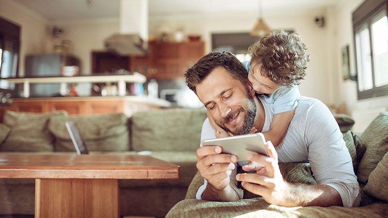father-son-using-tablet